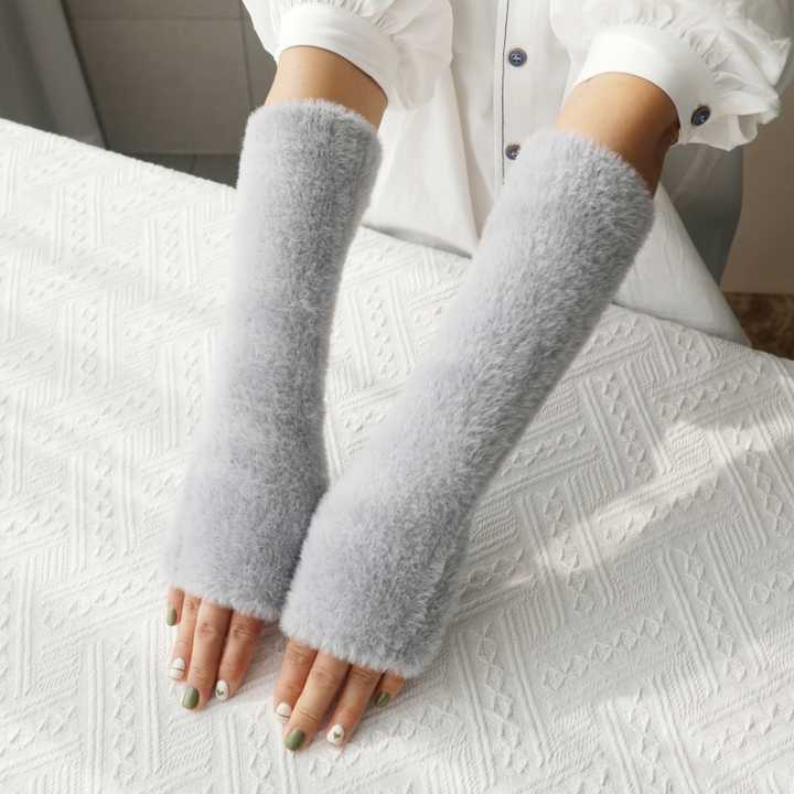 Half finger plush gloves for women's winter warmth.